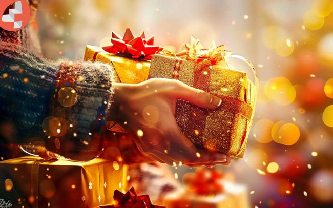 Person überreicht ein glitzerndes Geschenk mit rotem Band.