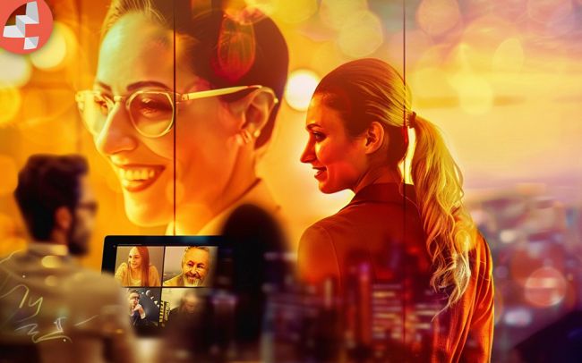 Menschen in einem virtuellen Meeting, während andere im Büro lachen