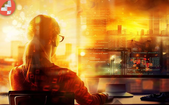 Frau arbeitet am Computer mit Stadtbildschirm im Hintergrund.